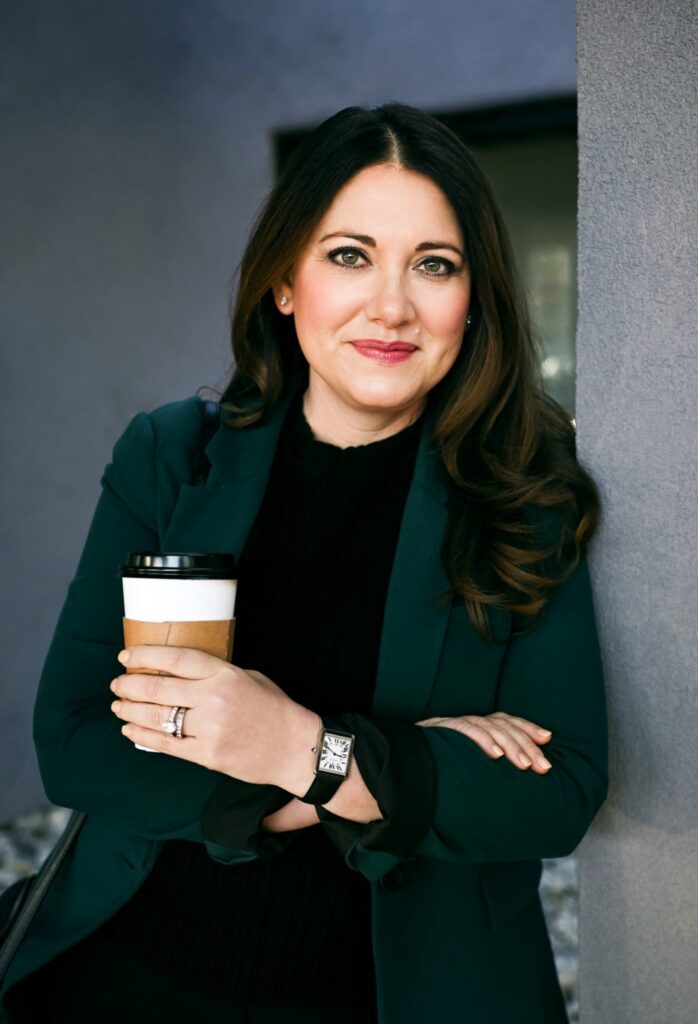 Photo of a beautiful woman holding a cup of coffee